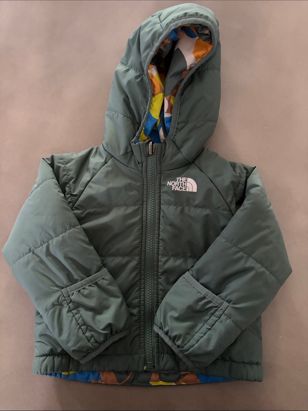 The North Face Baby Reversible Puffer with Hood & Hand Covers. 6-12 Months.